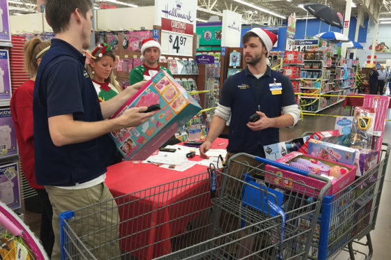 Joy of Giving Volunteers Helping with Presents | The Joy of Giving supports families in need in Collier County