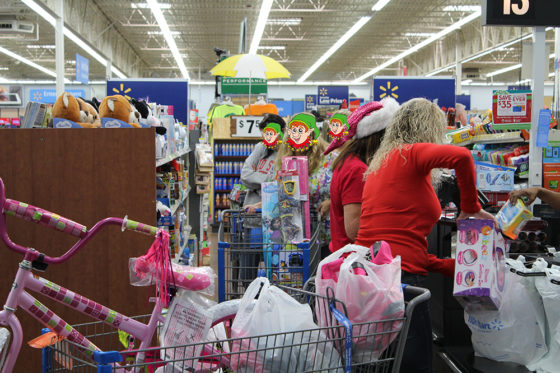 Cart full of Presents and Volunteers | The Joy of Giving supports families in need in Collier County