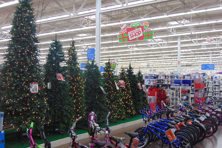 Row of Children's Bikes in Front of a row of Christmas Trees | The Joy of Giving supports families in need in Collier County