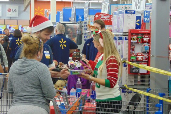 Joy of Giving Volunteers Helping Parents Choose Toys | The Joy of Giving supports families in need in Collier County